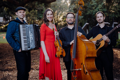 Estampa standing with their instruments